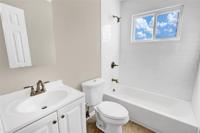 full bathroom with vanity, tiled shower / bath, and toilet