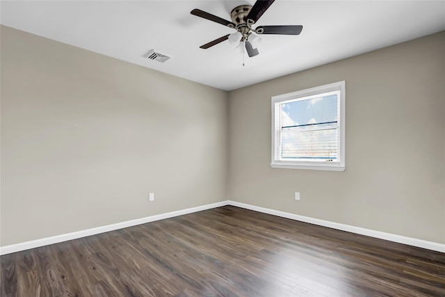 unfurnished room with dark wood-type flooring and ceiling fan