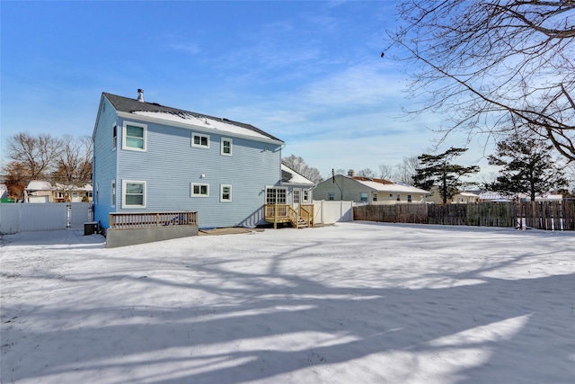 view of snow covered house