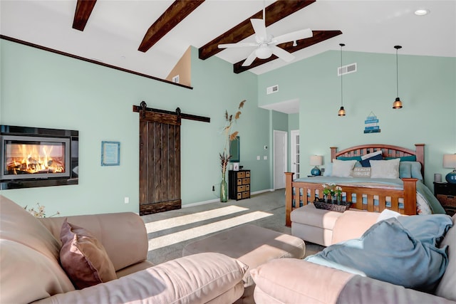 carpeted bedroom featuring a barn door, ceiling fan, beam ceiling, and high vaulted ceiling