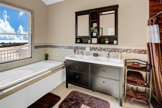 bathroom with vanity and a bathing tub