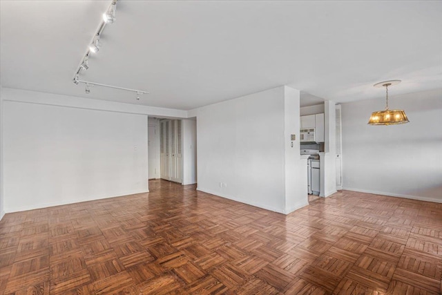 unfurnished room featuring dark parquet floors