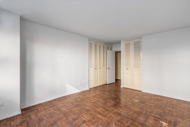 empty room with dark parquet floors