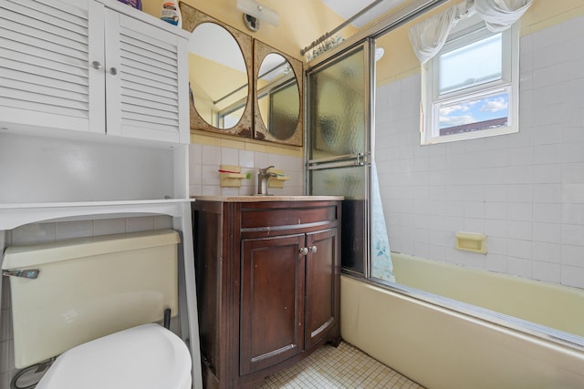 full bathroom featuring backsplash, tiled shower / bath combo, vanity, toilet, and tile patterned floors