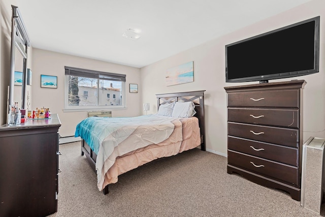 bedroom featuring light carpet and baseboard heating