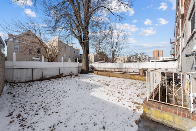 view of yard covered in snow