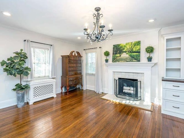 unfurnished living room featuring dark wood-type flooring, ornamental molding, and a healthy amount of sunlight