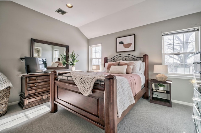 carpeted bedroom with vaulted ceiling