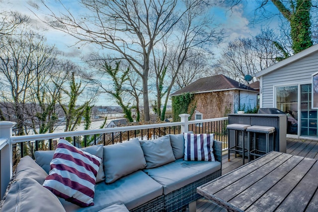 wooden terrace featuring an outdoor hangout area