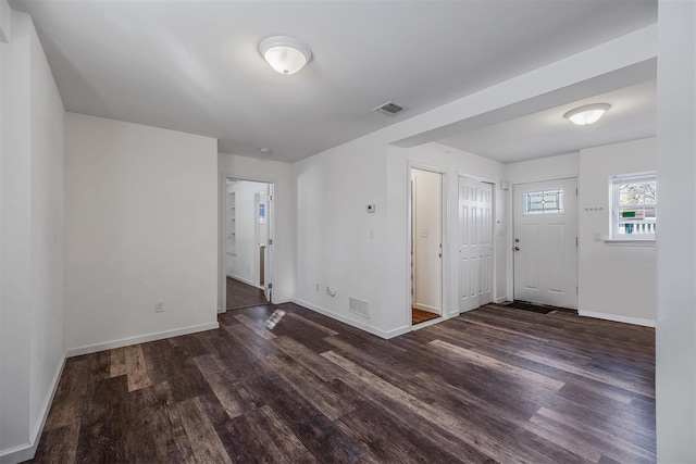 entrance foyer with dark hardwood / wood-style flooring