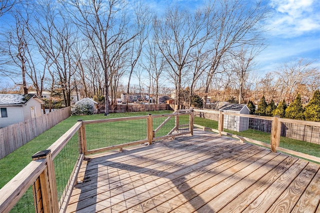 wooden deck featuring a yard