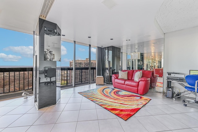 living room featuring light tile patterned flooring and floor to ceiling windows