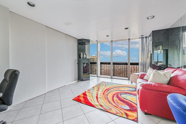 tiled living room featuring expansive windows