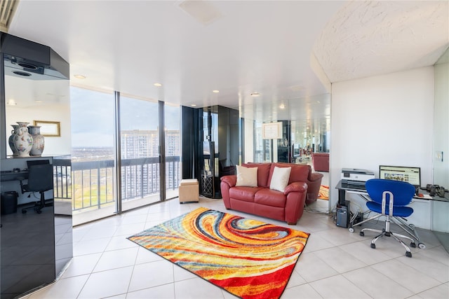 living room with expansive windows and light tile patterned flooring