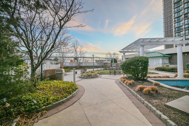 view of home's community featuring a pergola