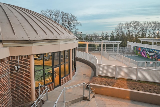 balcony featuring a pergola