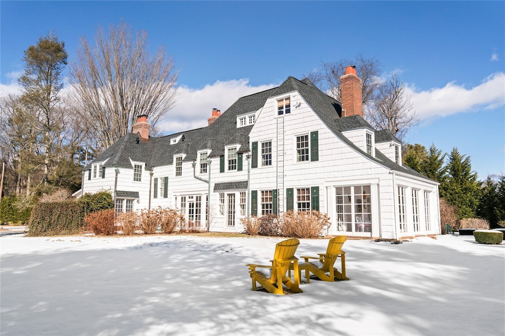 view of snow covered house