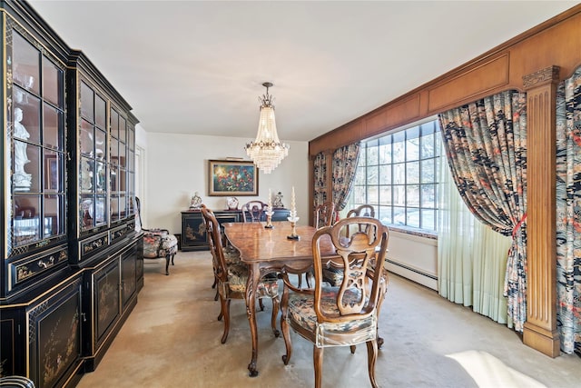 dining room featuring light carpet, a notable chandelier, and baseboard heating