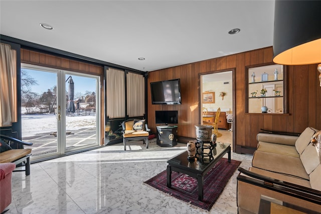 living room with wood walls