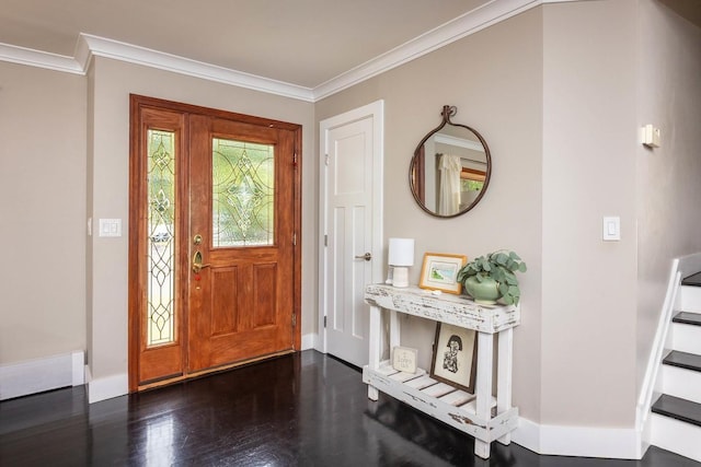 foyer entrance featuring ornamental molding and dark hardwood / wood-style floors