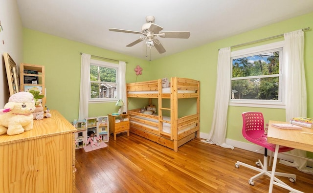 bedroom with hardwood / wood-style flooring and ceiling fan