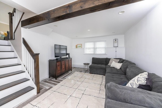 living room featuring beamed ceiling