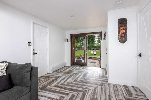 foyer featuring parquet flooring and crown molding