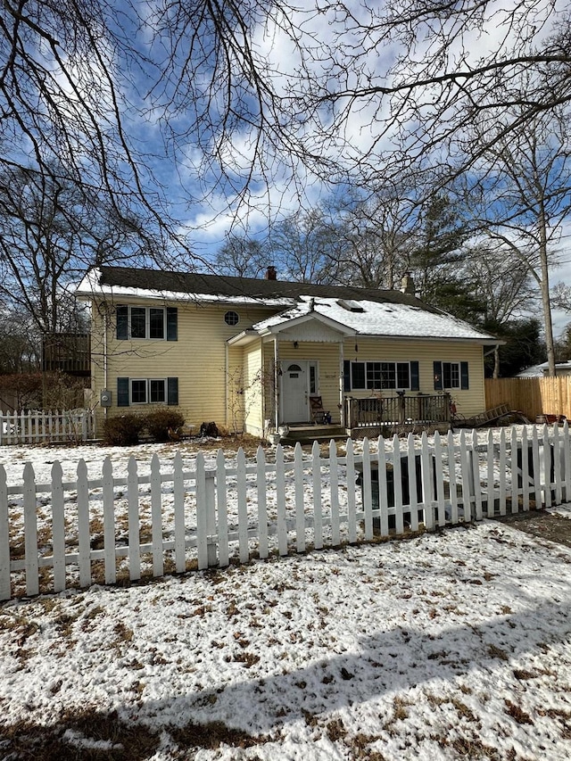 view of snow covered house