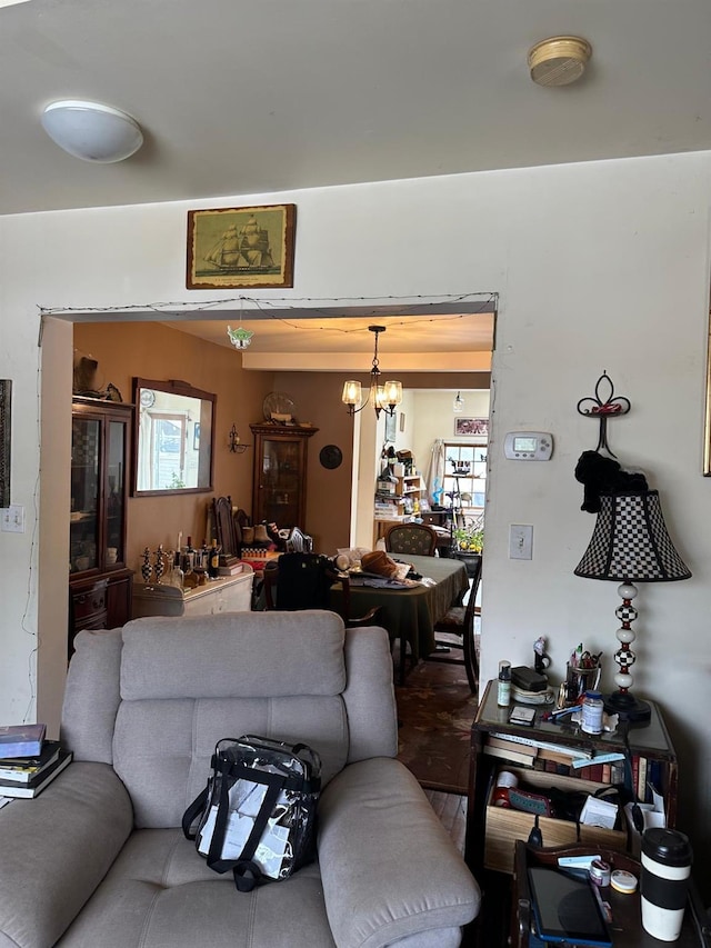 living room featuring a notable chandelier