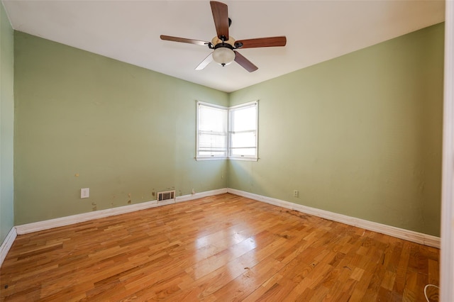 spare room featuring ceiling fan and light hardwood / wood-style flooring