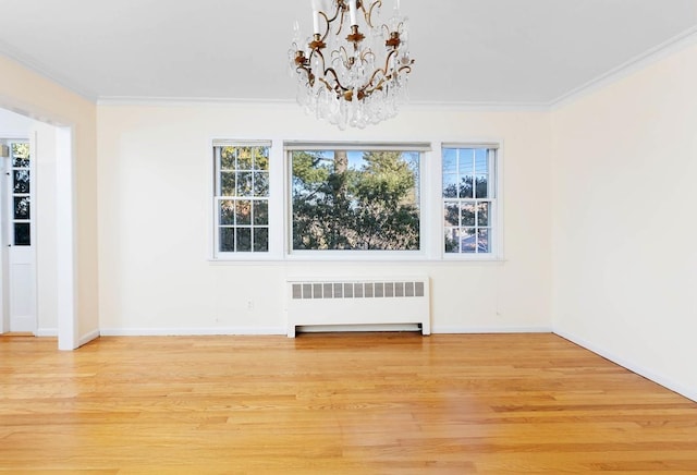 unfurnished dining area featuring ornamental molding, radiator, wood-type flooring, and plenty of natural light