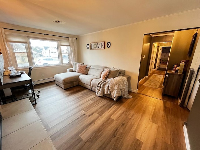 living room featuring ornamental molding, a baseboard radiator, and light hardwood / wood-style floors