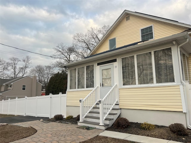 view of front of home featuring a patio and a sunroom