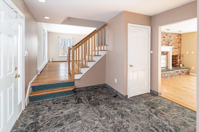 foyer with a large fireplace