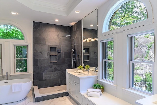 bathroom with vanity, ornamental molding, shower with separate bathtub, and a healthy amount of sunlight