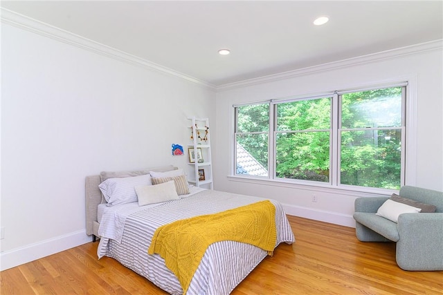 bedroom with crown molding and wood-type flooring