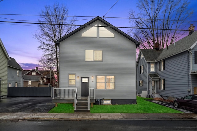 view of front of home with a yard