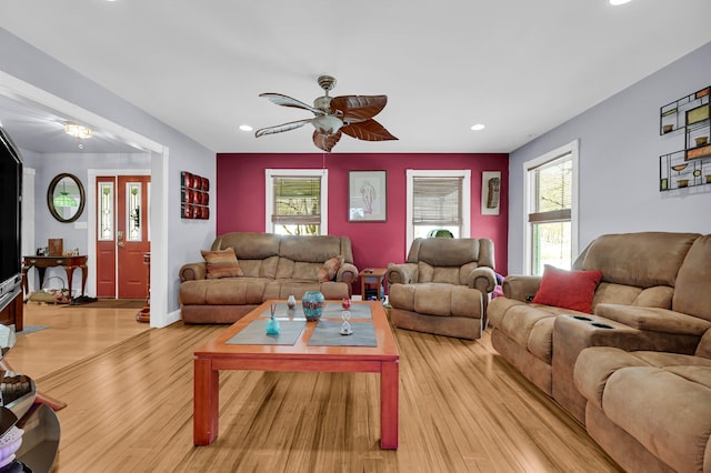 living area featuring a ceiling fan, light wood-type flooring, and recessed lighting