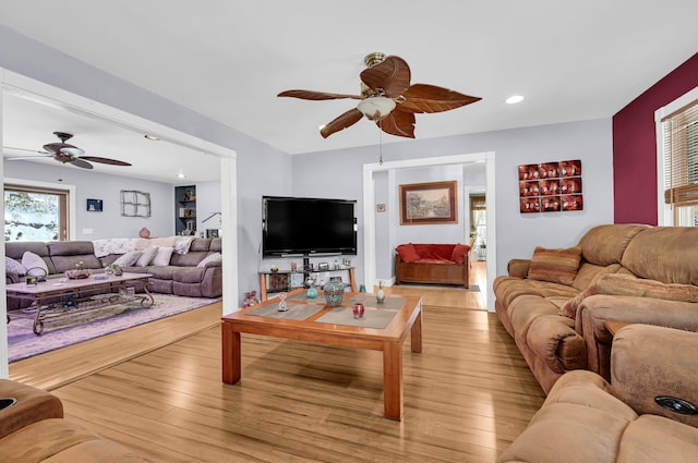 living area featuring ceiling fan, light wood-style flooring, and recessed lighting