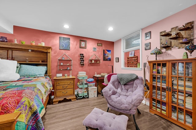 bedroom featuring wood finished floors and recessed lighting