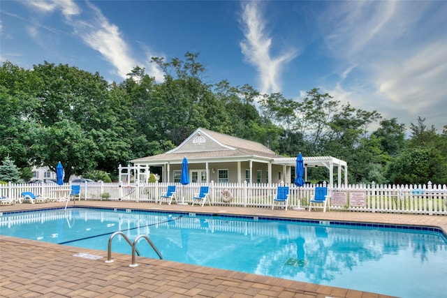 view of swimming pool with a pergola