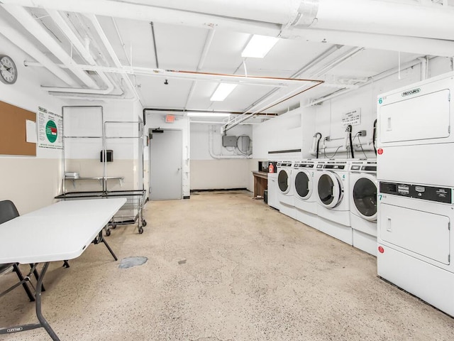 washroom featuring stacked washing maching and dryer