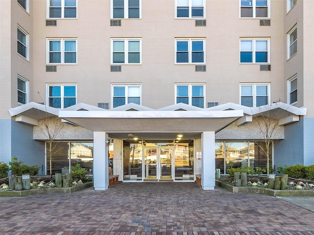 view of exterior entry featuring french doors