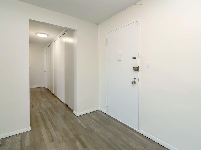 hall with light hardwood / wood-style flooring