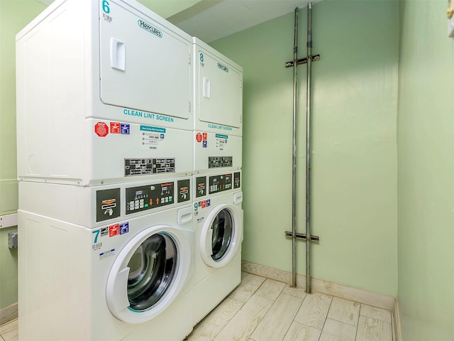 clothes washing area featuring washing machine and clothes dryer and stacked washer / dryer