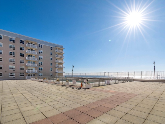 view of patio featuring a water view