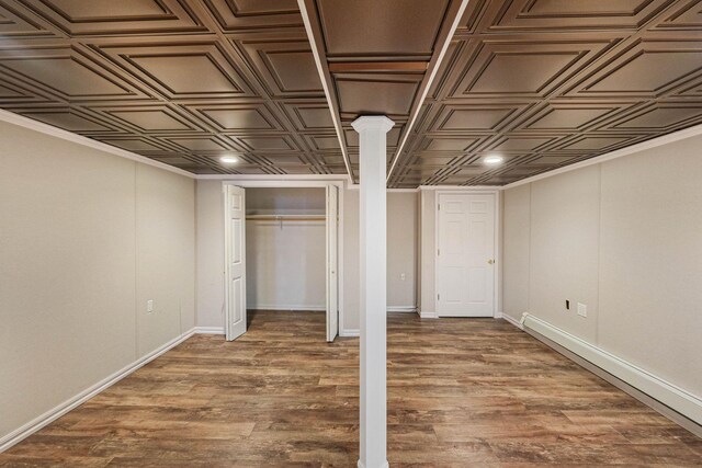 basement with hardwood / wood-style flooring