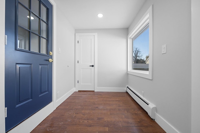 entrance foyer featuring dark hardwood / wood-style flooring and a baseboard radiator