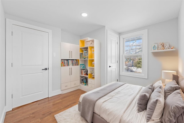 bedroom with light wood-type flooring