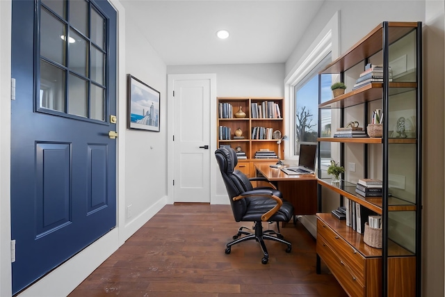 home office with dark hardwood / wood-style floors